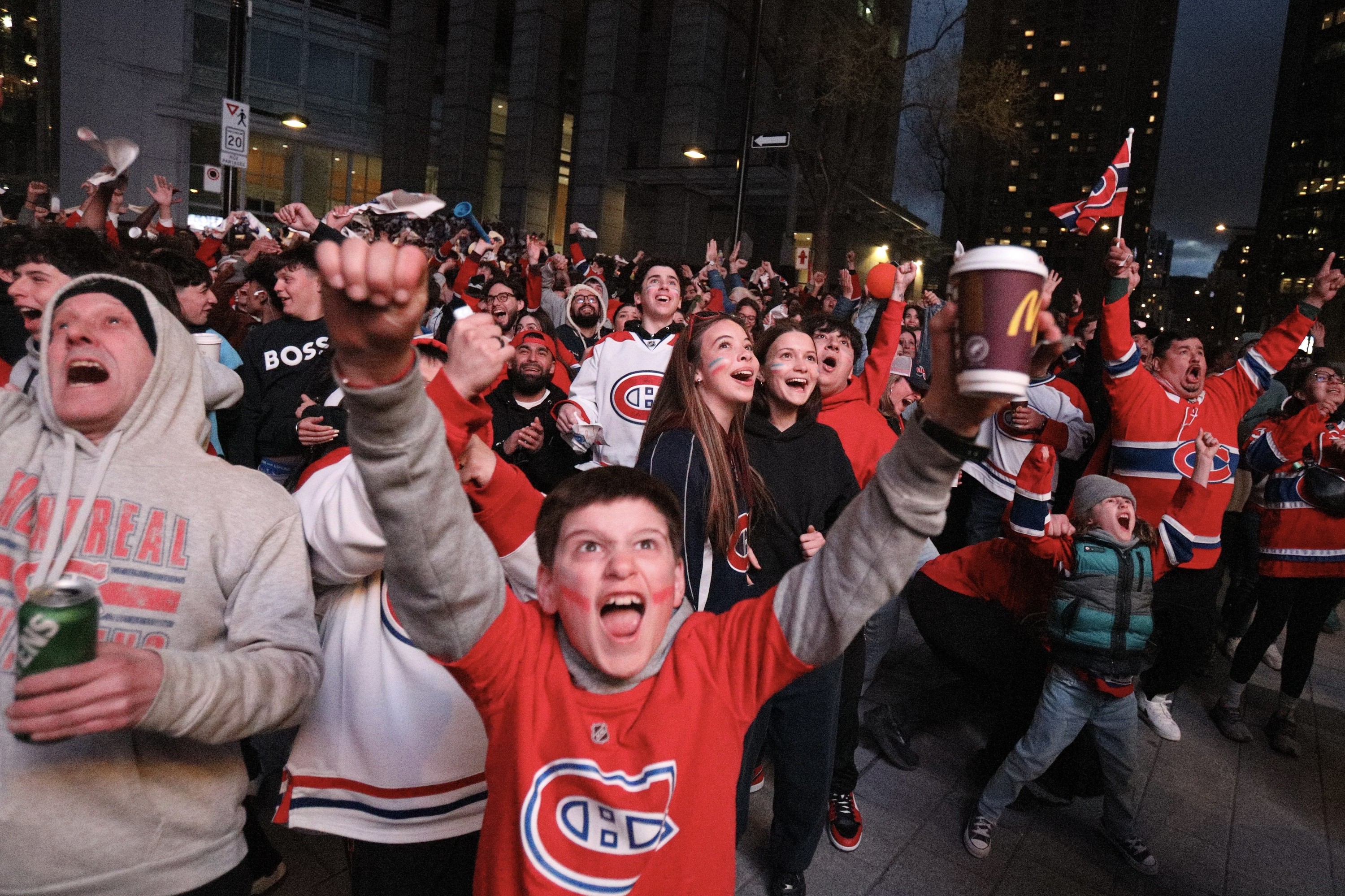 Fans outside the Bell Centre cheer a second-period goal by the Canadiens against the Sabres during Game 3 Sunday night.