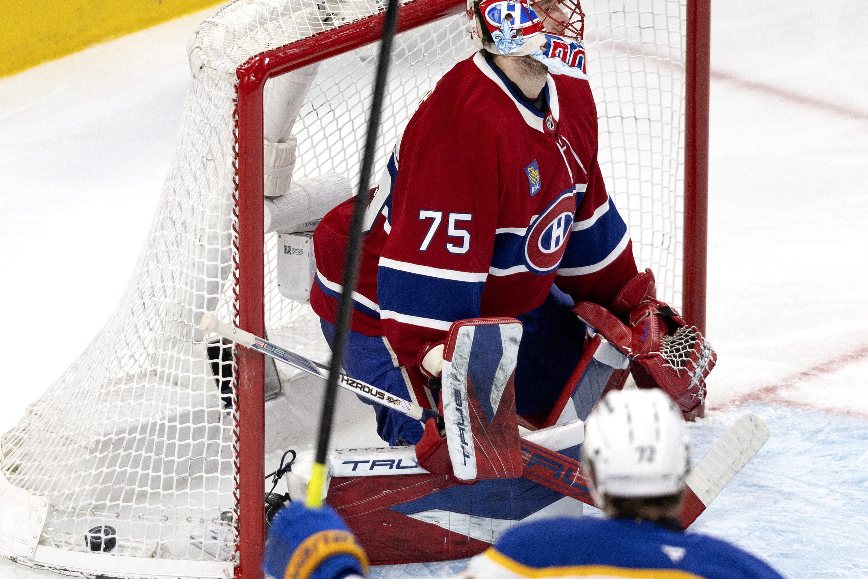 The puck is in the back of the net behind Canadiens goalie Jakub Dobes while Buffalo Sabres centre Tage Thompson (72) celebrates.
