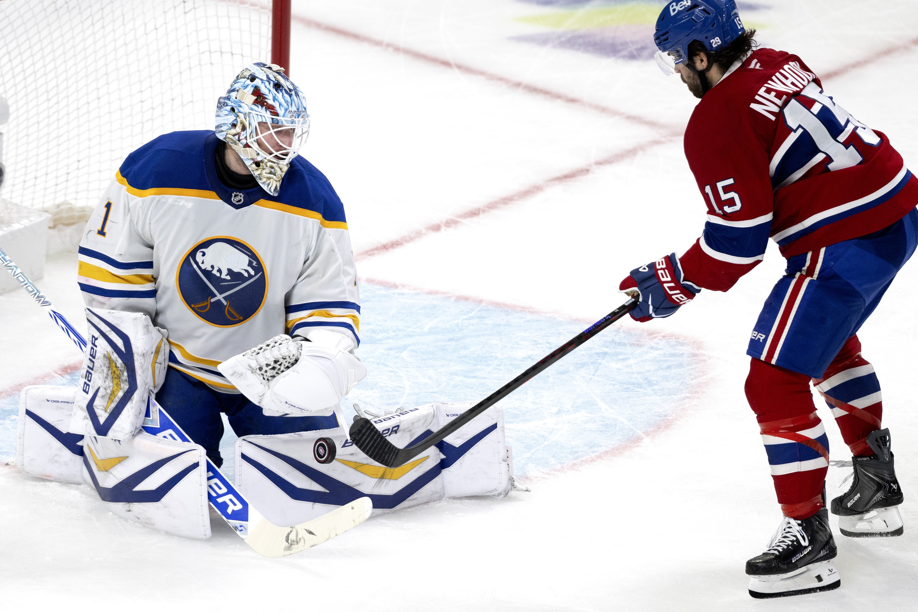 Canadiens centre Alex Newhook (15) is stopped by Buffalo Sabres goaltender Ukko-Pekka Luukkonen (1)
