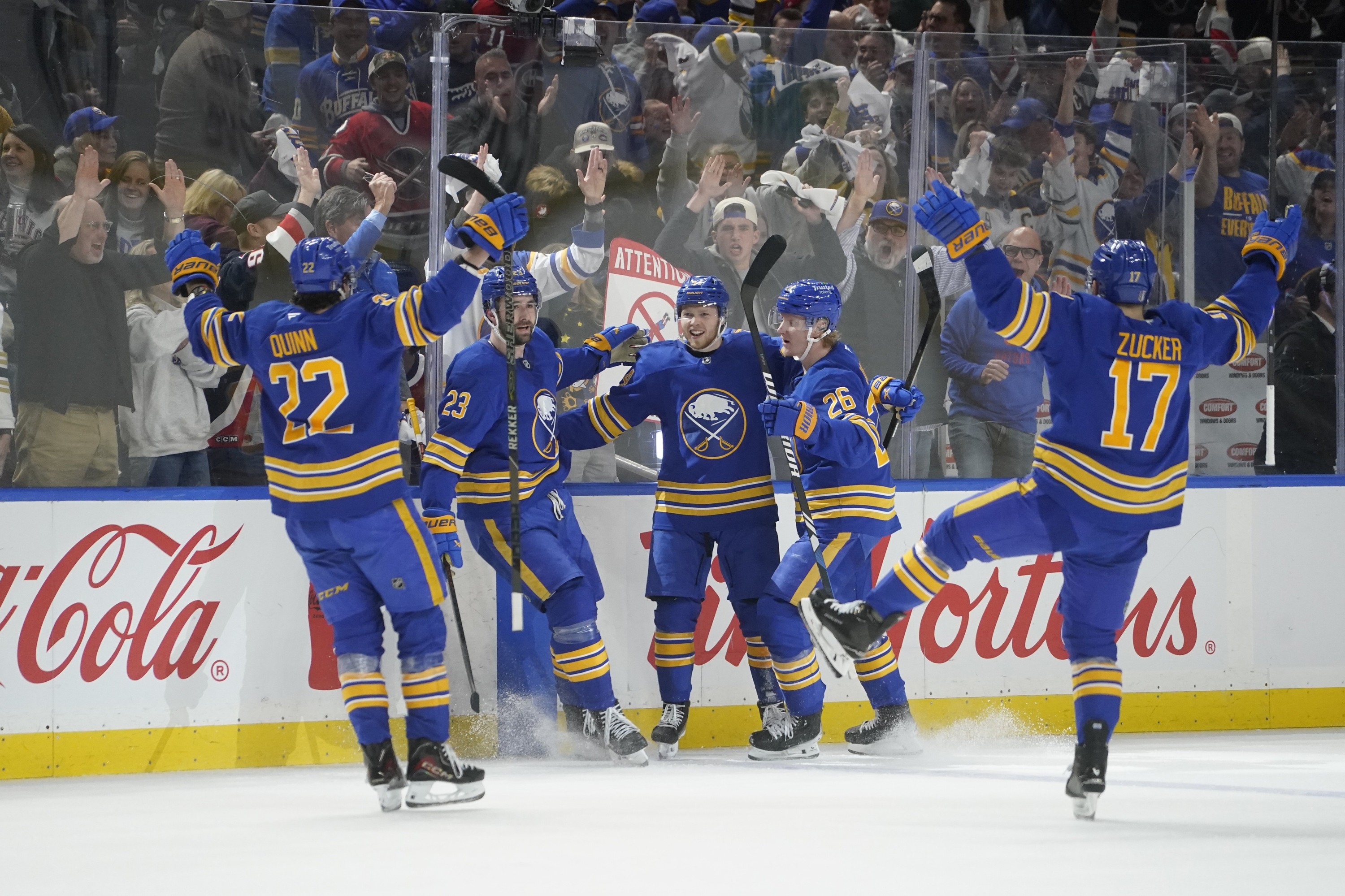 Sabres hockey players celebrating on the ice