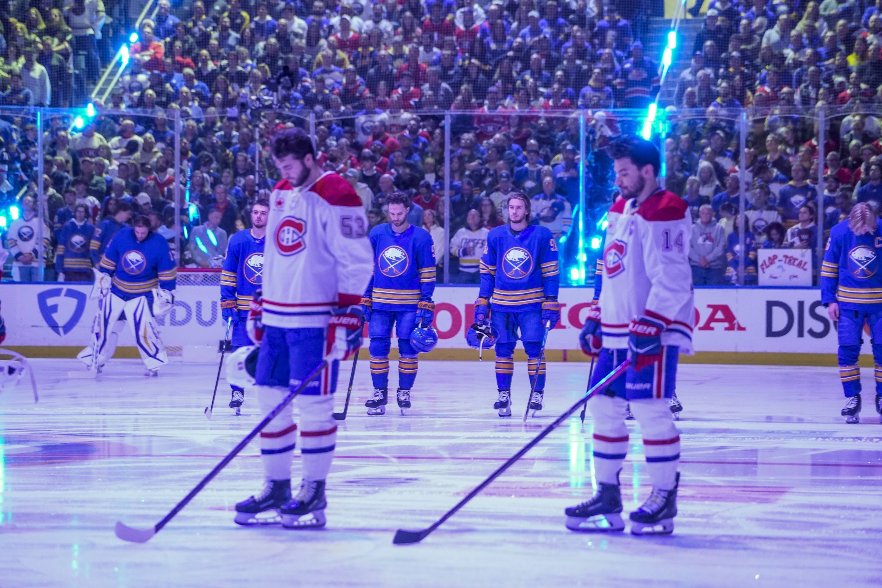 Canadiens players standing on ice during moment of silence