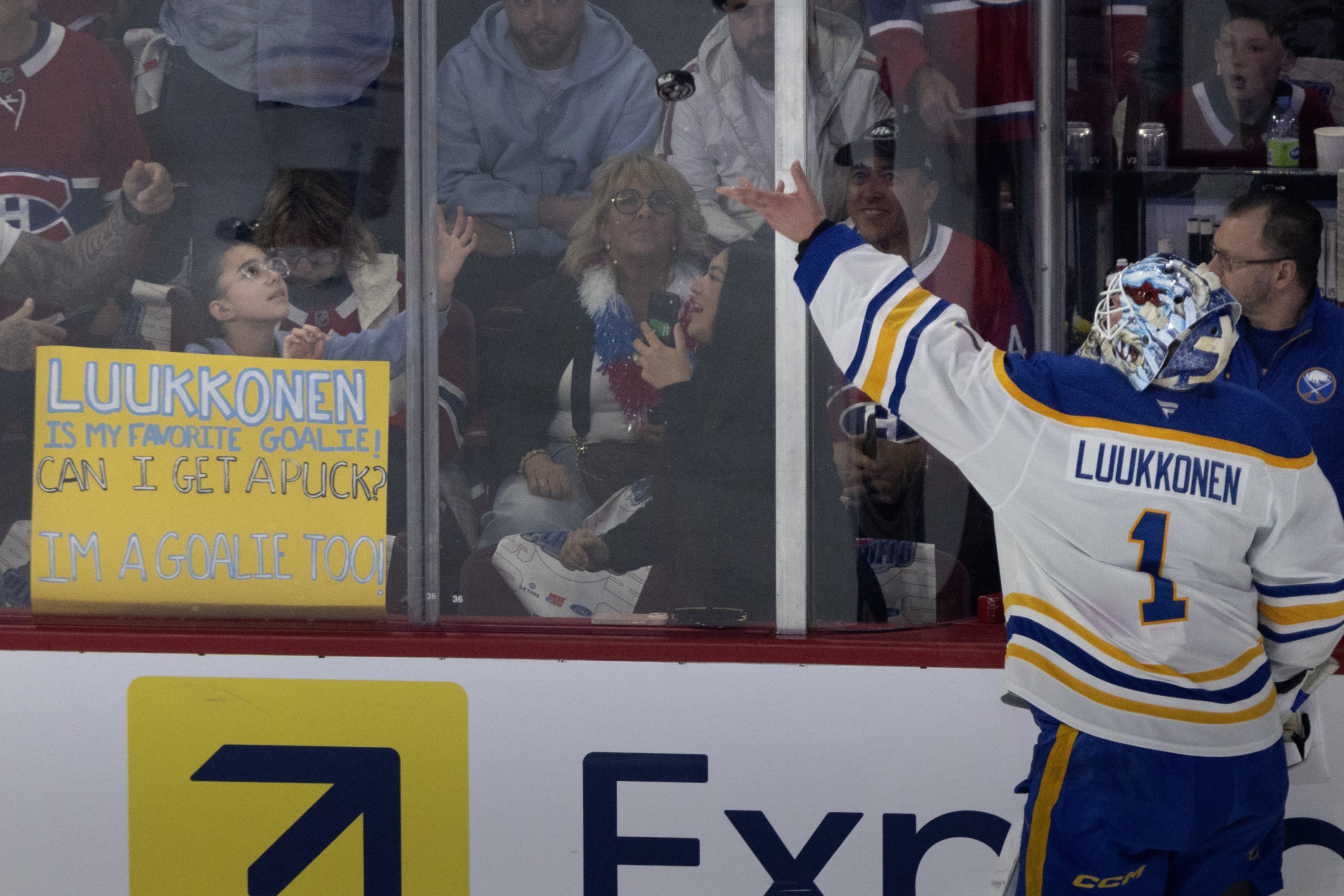 Buffalo Sabres goaltender Ukko-Pekka Luukkonen makes a young hockey fan's day by tossing a puck over the glass for her during the pregame skate of Game 6.