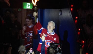 Larry Robinson carries the torch into the Bell Centre during the pregame ceremony of Game 6.