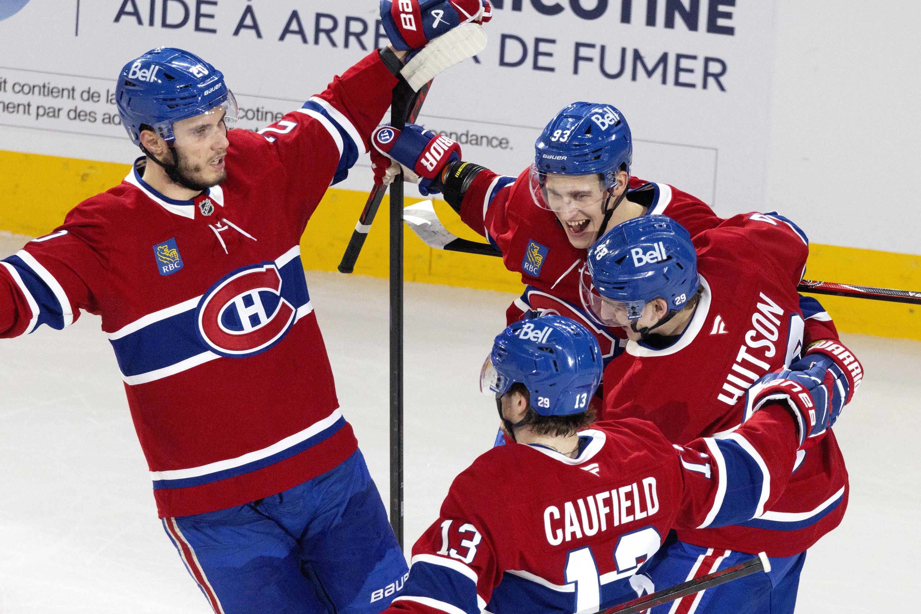 Canadiens' Ivan Demidov (93) celebrates with teammates Juraj Slafkovský (20), Cole Caufield (13) and Lane Hutson (48) after scoring against Buffalo Sabres goaltender Ukko-Pekka Luukkonen in Game 6.