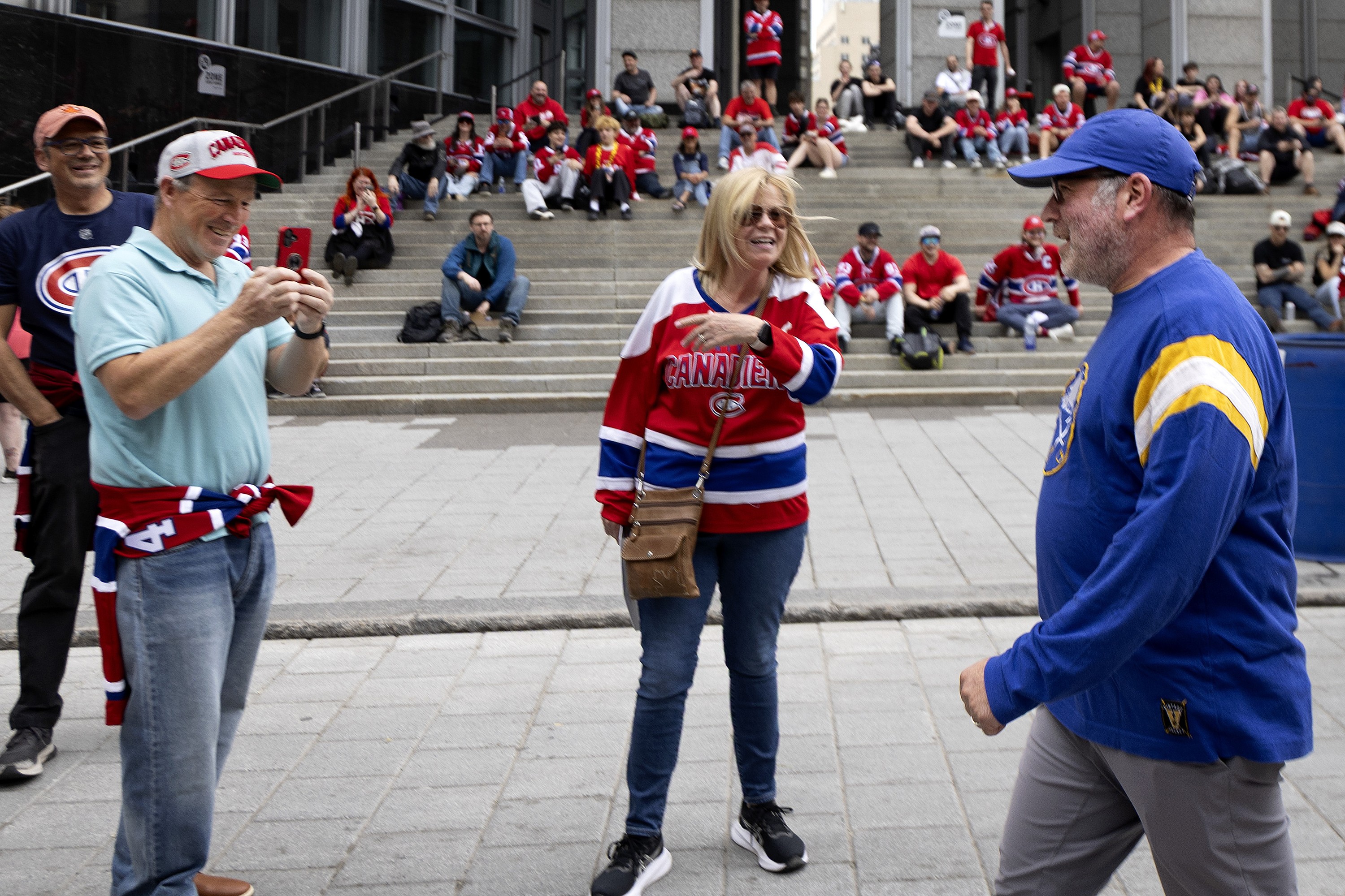 Sabres hockey fan gets teased by Canadiens fans in Montreal before a game. 