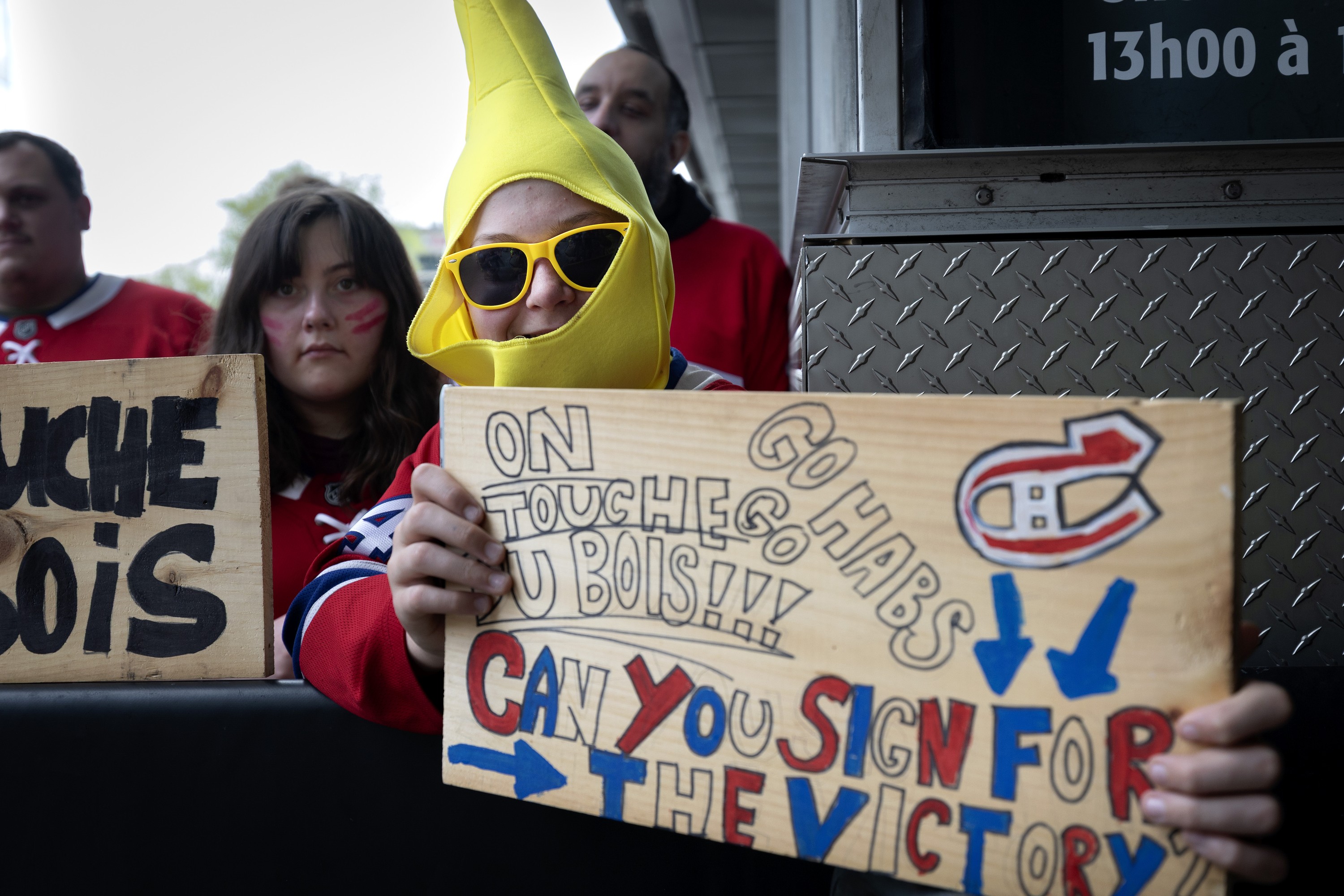 Canadiens fans line St-Antoine St. in Montreal in hopes of getting a glimpse of players. 