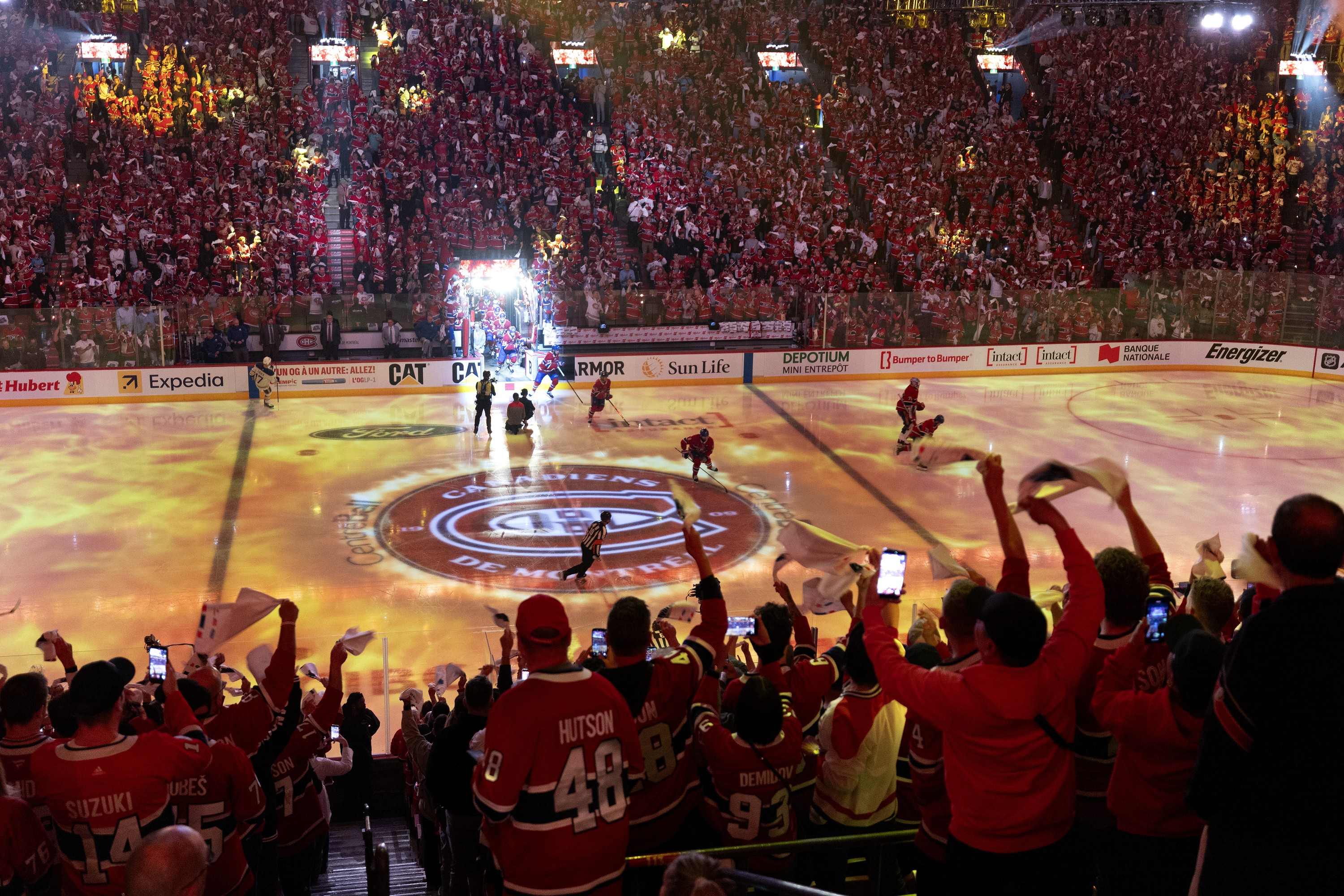Canadiens fans cheer as the players take to the ice at the Bell Centre during Game 6.