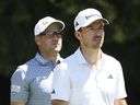 Canadian golfers Nick Taylor (right) and Corey Conners walk off the fourth hole tee box during the third round of the PGA Championship at Aronimink Golf Club on May 16, 2026 in Newtown, Pa.