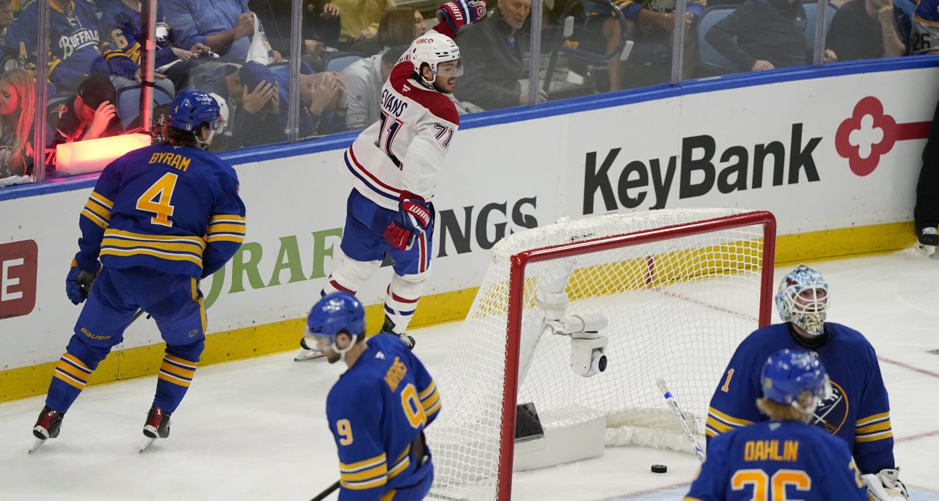 Buffalo Sabres goaltender Ukko-Pekka Luukkonen (1) looks up as Montreal Canadiens centre Jake Evans (17) celebrates skating behind the net