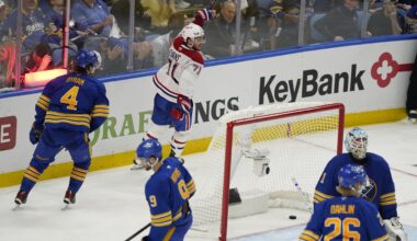 Buffalo Sabres goaltender Ukko-Pekka Luukkonen (1) looks up as Montreal Canadiens centre Jake Evans (17) celebrates skating behind the net