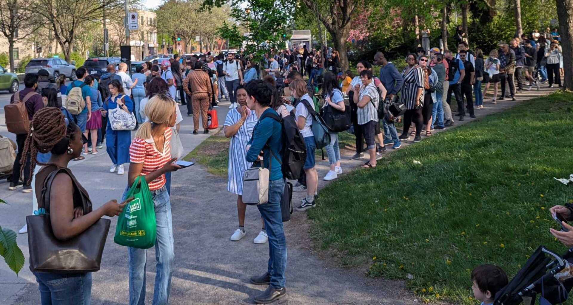 People wait in long lines outside.