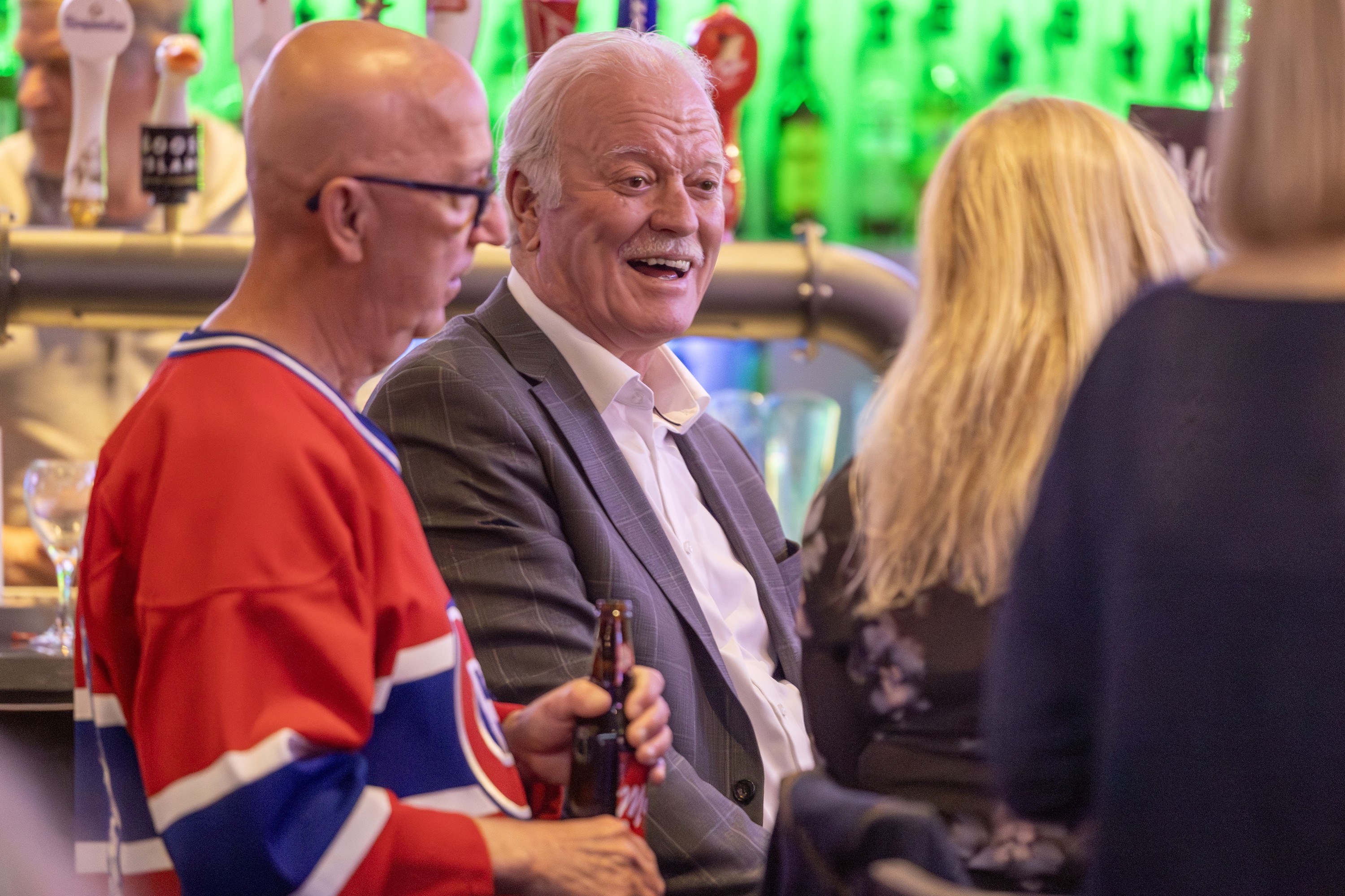 Former Canadien Yvon Lambert, centre, speaks to Habs fans while watching Game 1 of Eastern Conference final against the Carolina Hurricanes at Brasserie des Rapides in LaSalle on Thursday night.