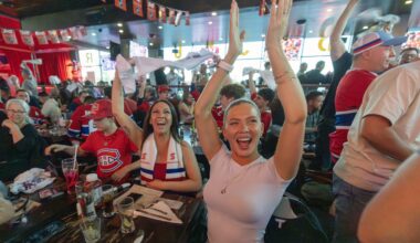 Canadiens fans Madison McLellan, right, and Melissa Ayotte celebrate a Habs goal while watching the Game 1 of Eastern Conference final against the Carolina Hurricanes at Brasserie des Rapides in LaSalle on Thursday night.