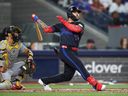 Yohendrick Pinango of the Toronto Blue Jays hits a two-run double in the third inning during a game against the Pittsburgh Pirates at Rogers Centre on May 22, 2026 in Toronto.