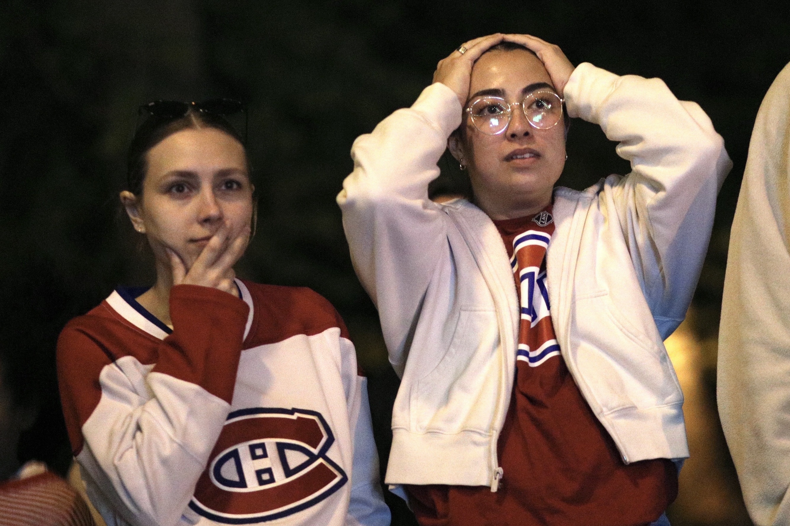 Allison Ojerio, right, and Sabrina Roy sport Canadiens jerseys and nervous expressions.