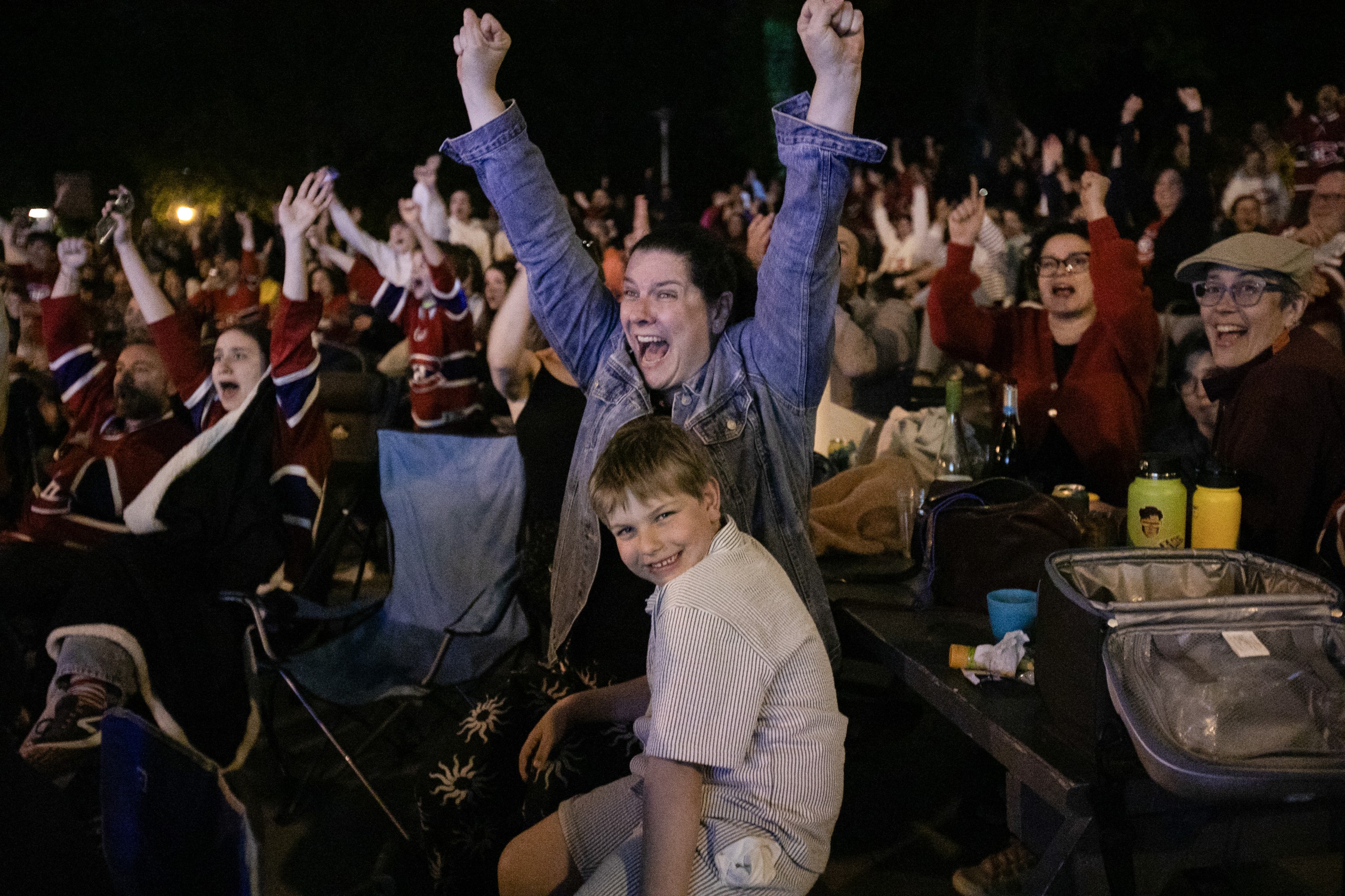 Anne-Julie Gratton, with son Louis Forget, cheer in excitement after a goal by the Canadiens.