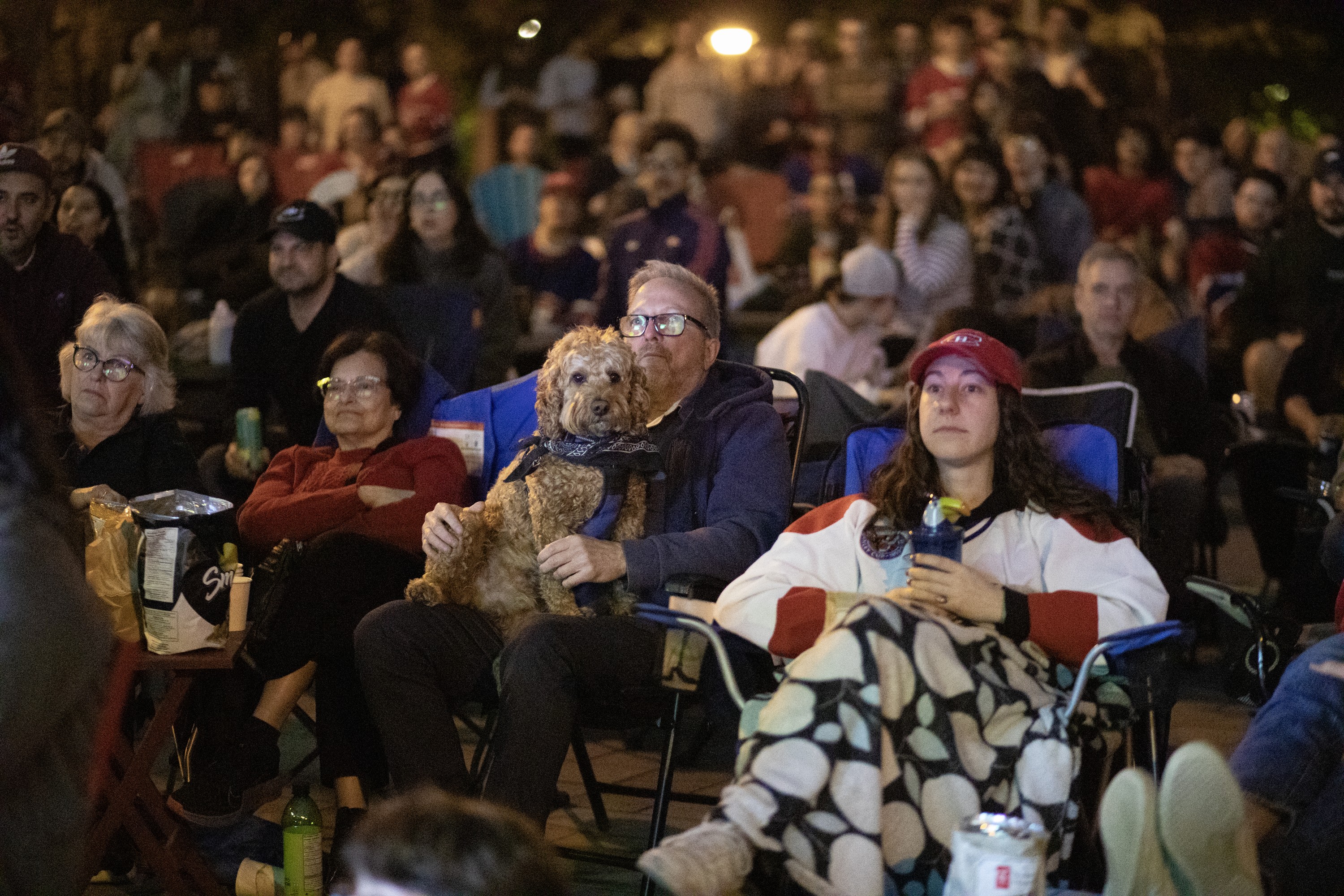 Michel Rizzoli and his dog Buddy were among the crowd taking in Game 2 on the big screen int he park.