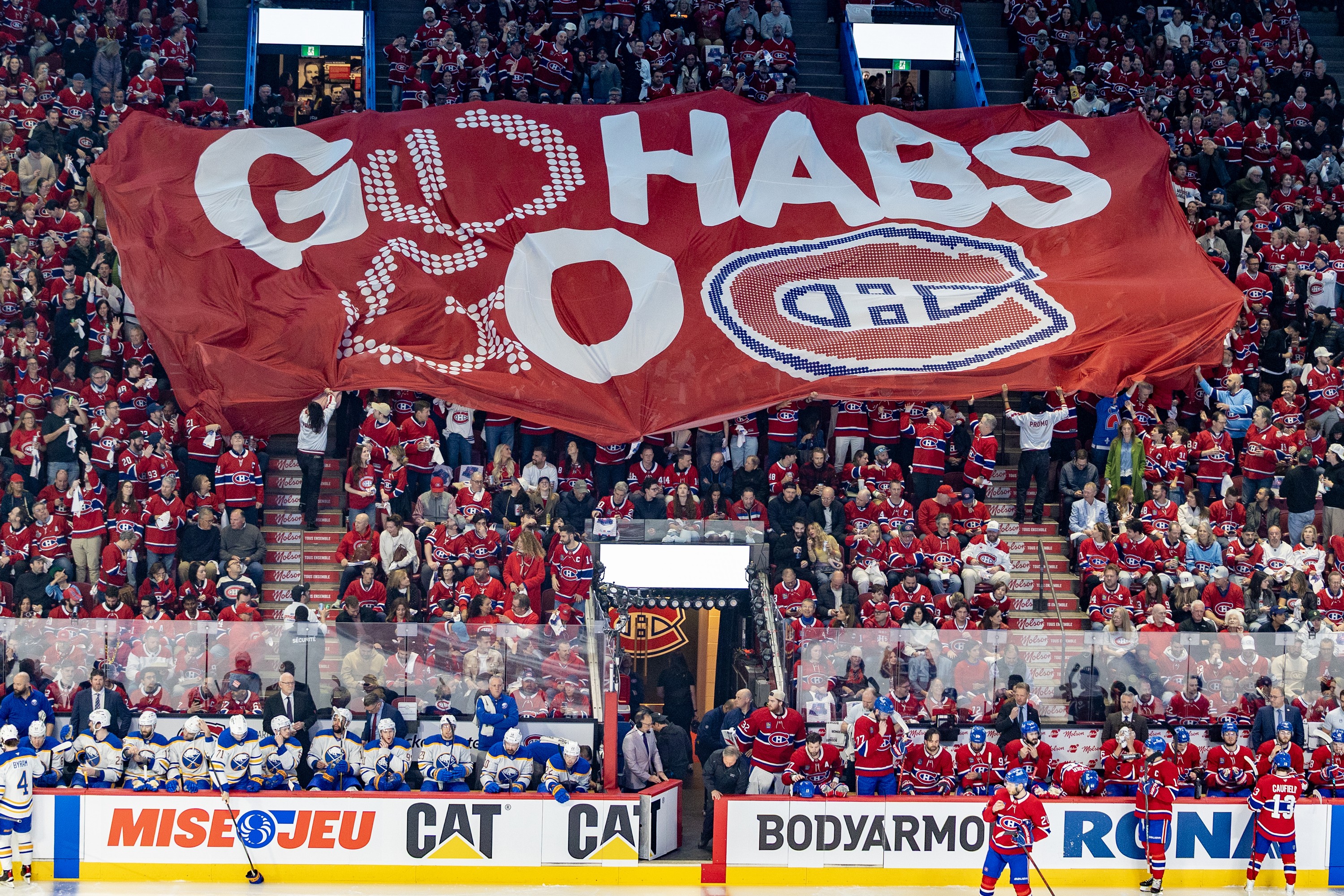 A banner is passed over the crowd before the start of Game 3 of the Canadiens-Sabres second-round series in Montreal on May 10.