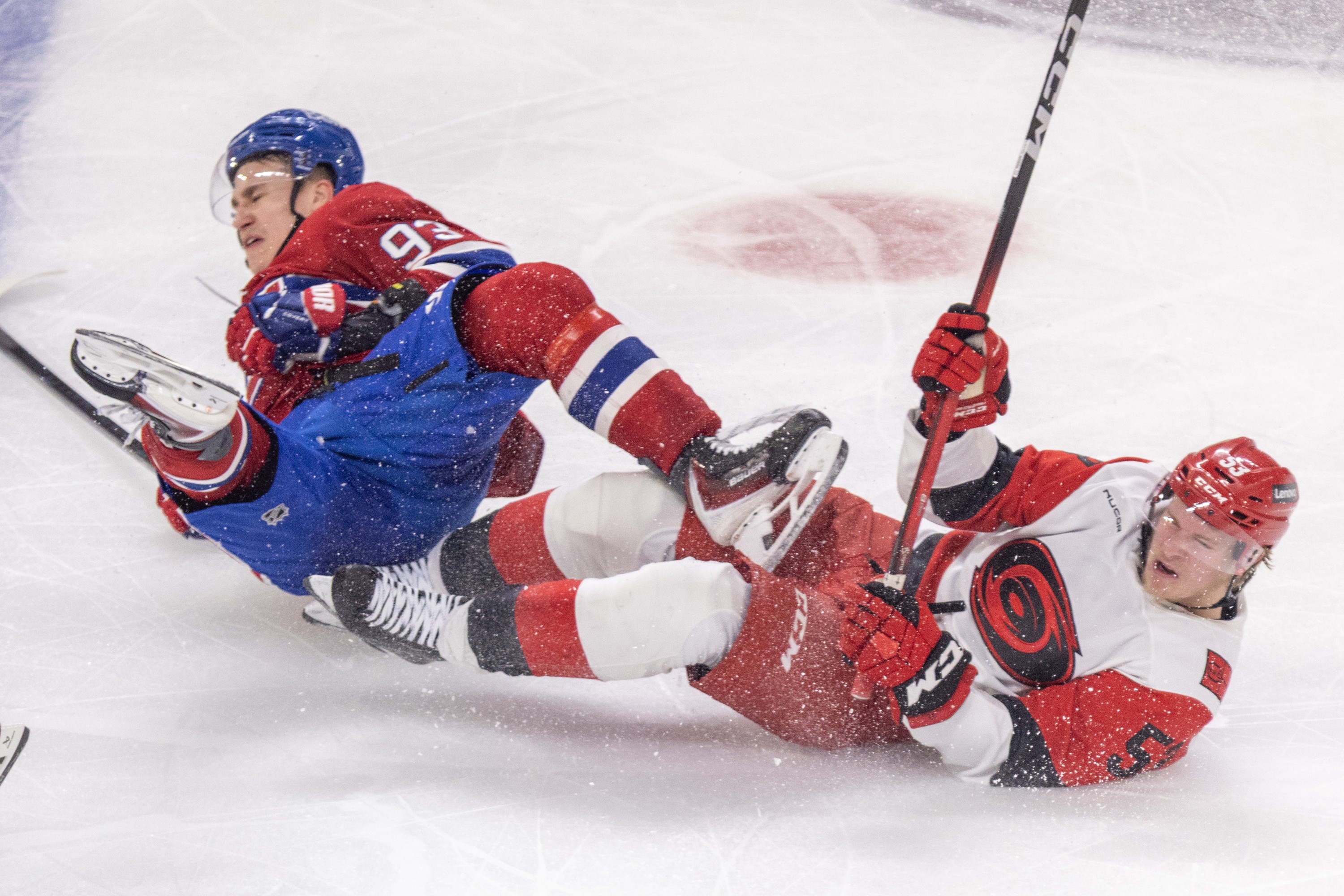 Canadiens winger Ivan Demidov is taken down by Carolina Hurricanes' Jackson Blake during second period of Game 3 in Montreal on Monday.