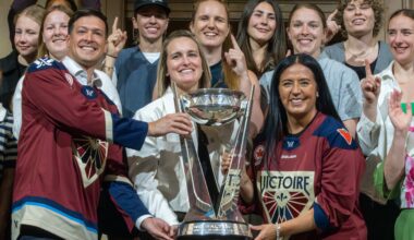 Laval Mayor Stéphane Boyer and Montreal Mayor Soraya Martinez Ferrada flank Victoire captain Marie-Philip Poulin with the Walter Cup, with teammates behind them.