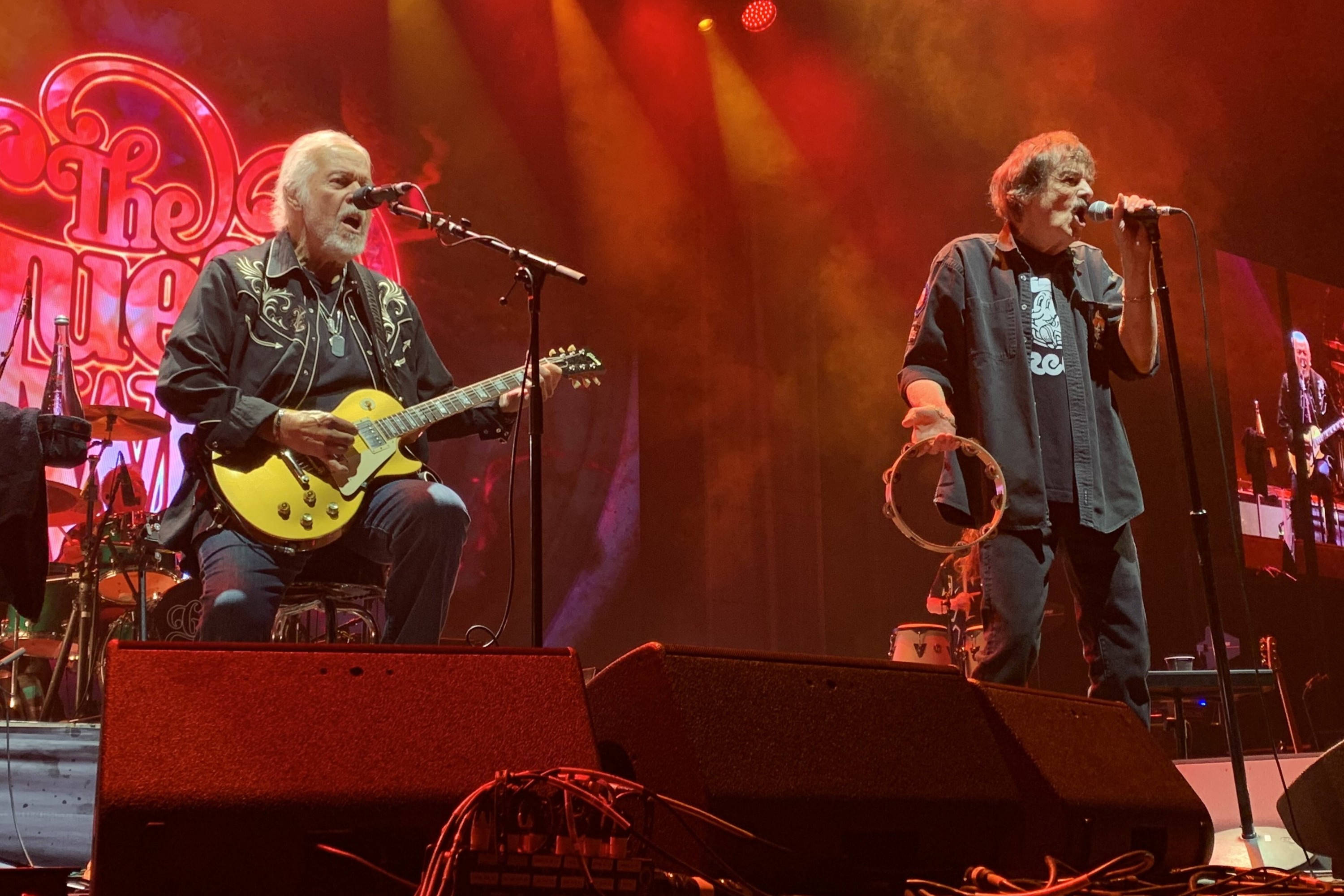 Randy Bachman, left, and Burton Cummings perform on stage.
