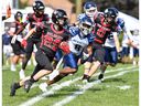 Cornwall Wildcats running back Hunter Holmes (No. 29) chews up some yardage against the Oshawa Hawkeyes on Saturday, June 14, 2025, in Cornwall, Ont. The Wildcats won 16-9. 