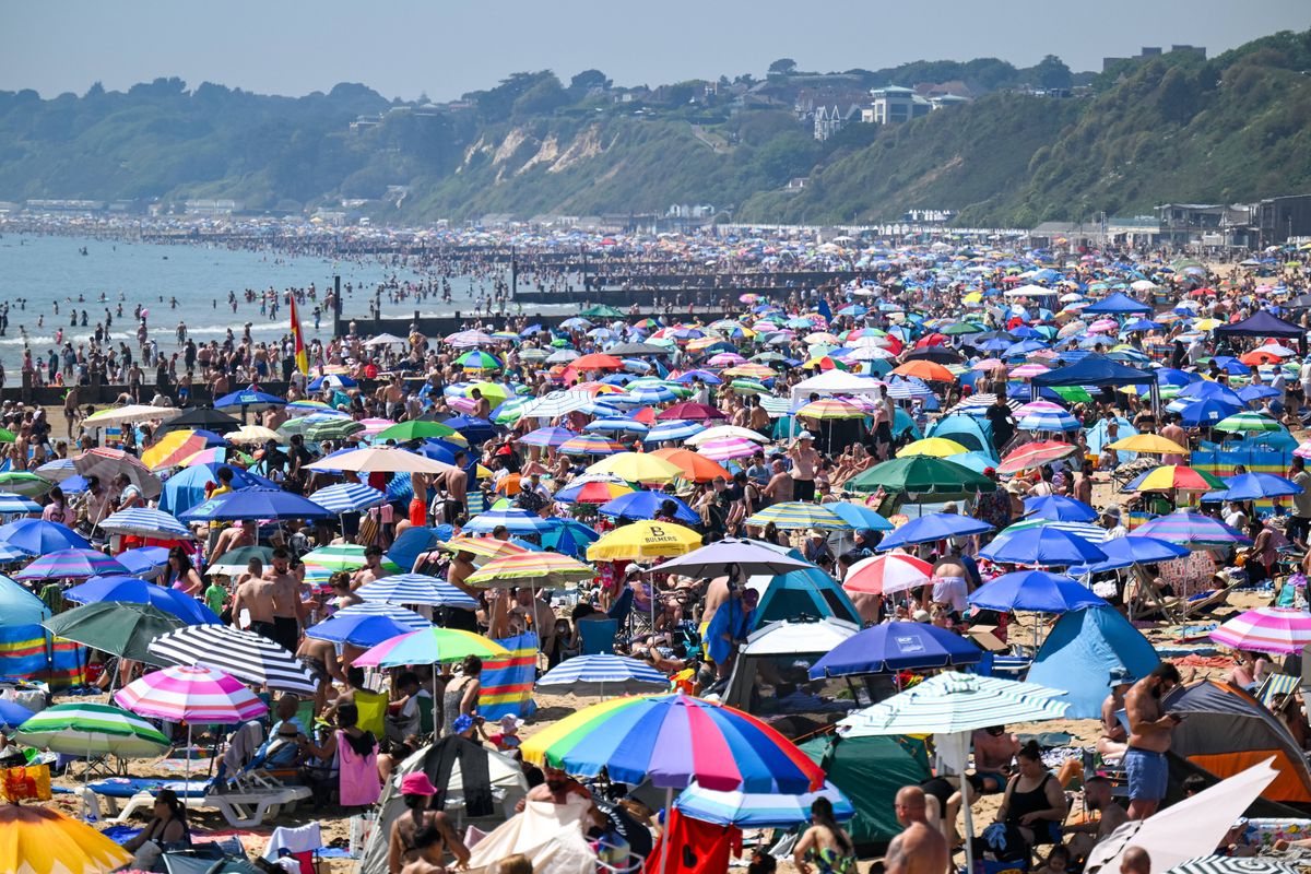 Visitors enjoy the hot weather at Bournemouth beach, on May 25, 2026 in Bournemouth, England