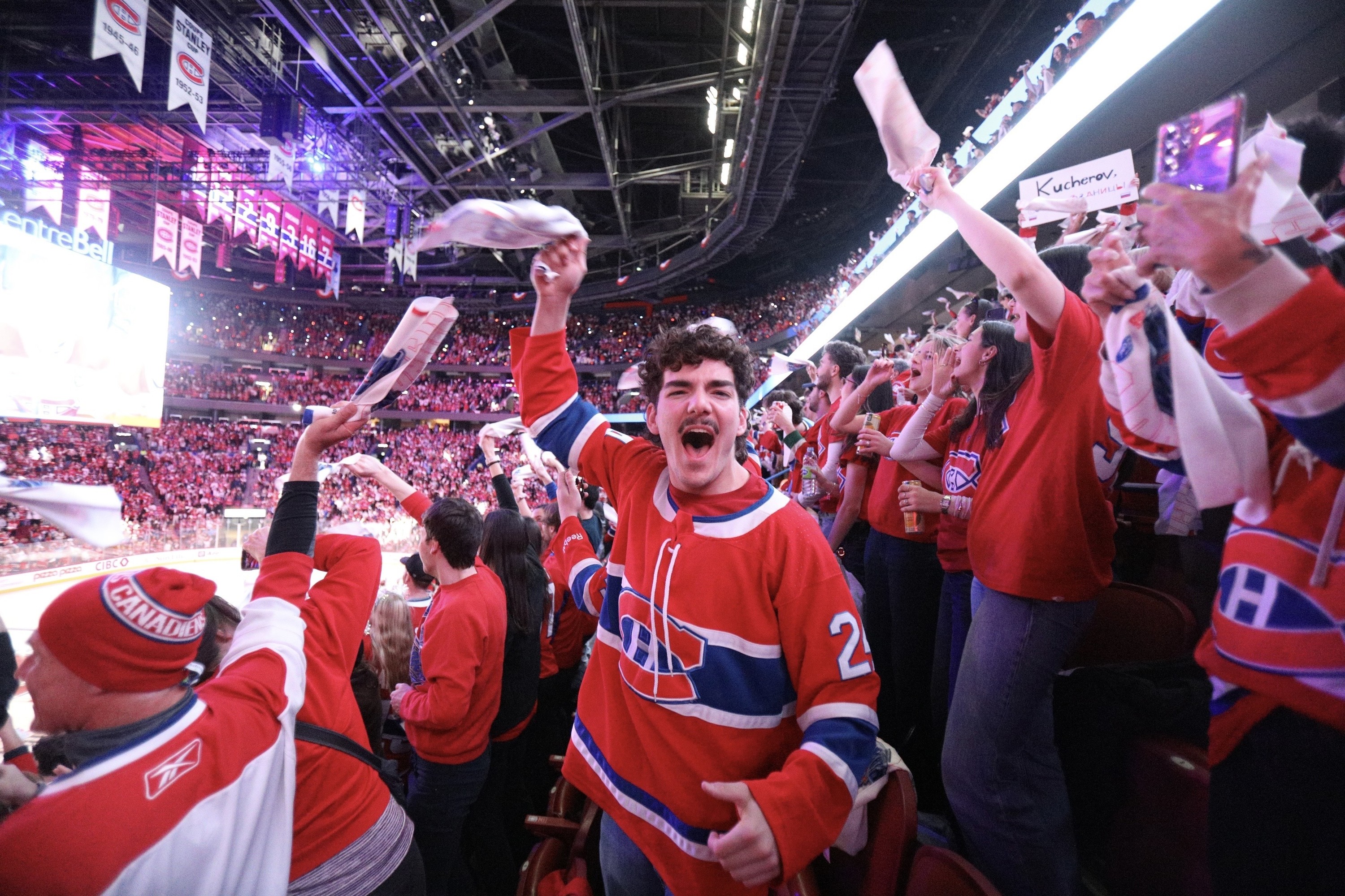 Montreal Canadiens fans cheer in the stands.