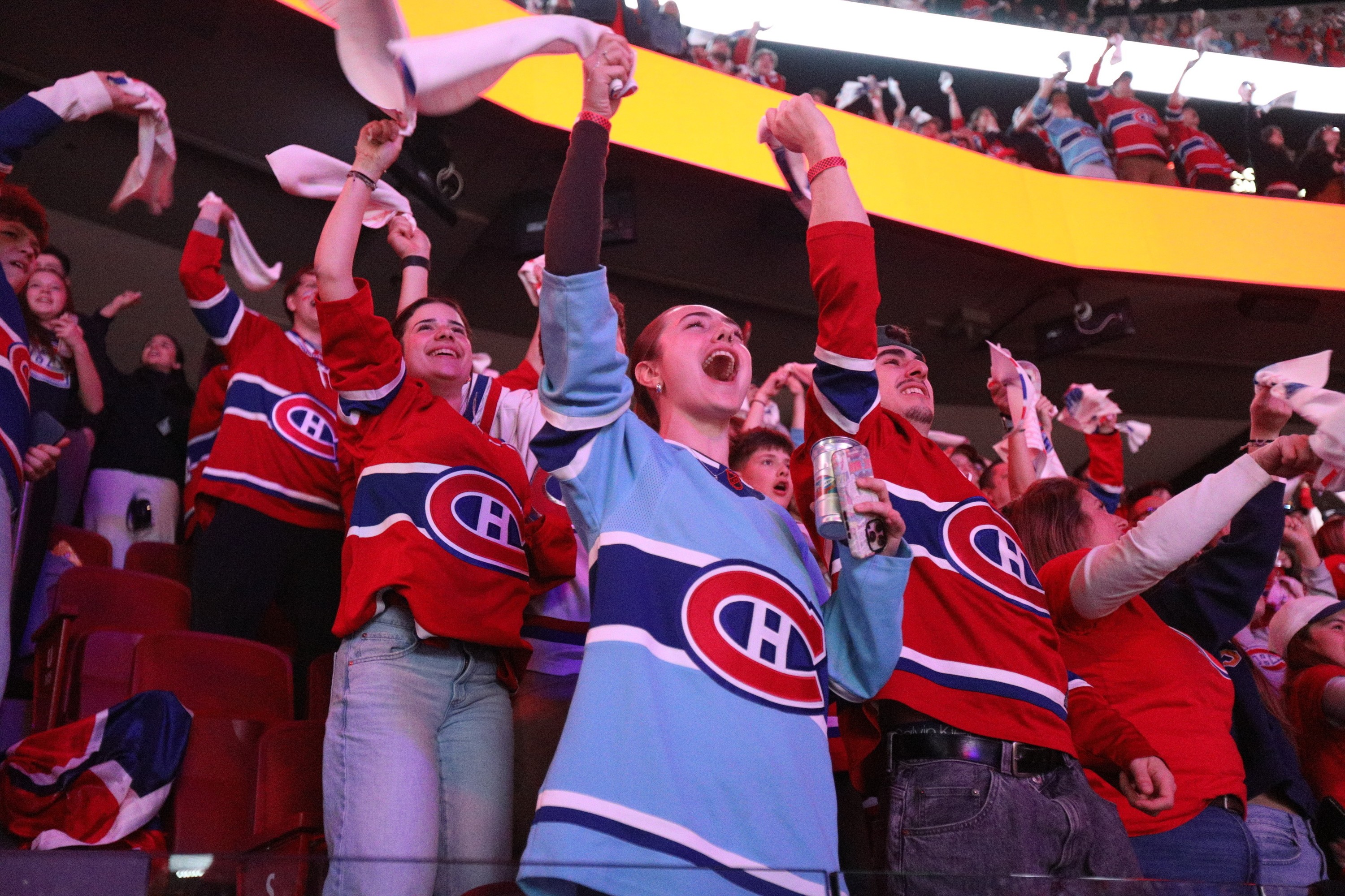 Montreal Canadiens fans at the Bell Centre celebrate the team's 2-1 win against the Tampa Bay Lightning during a watch party