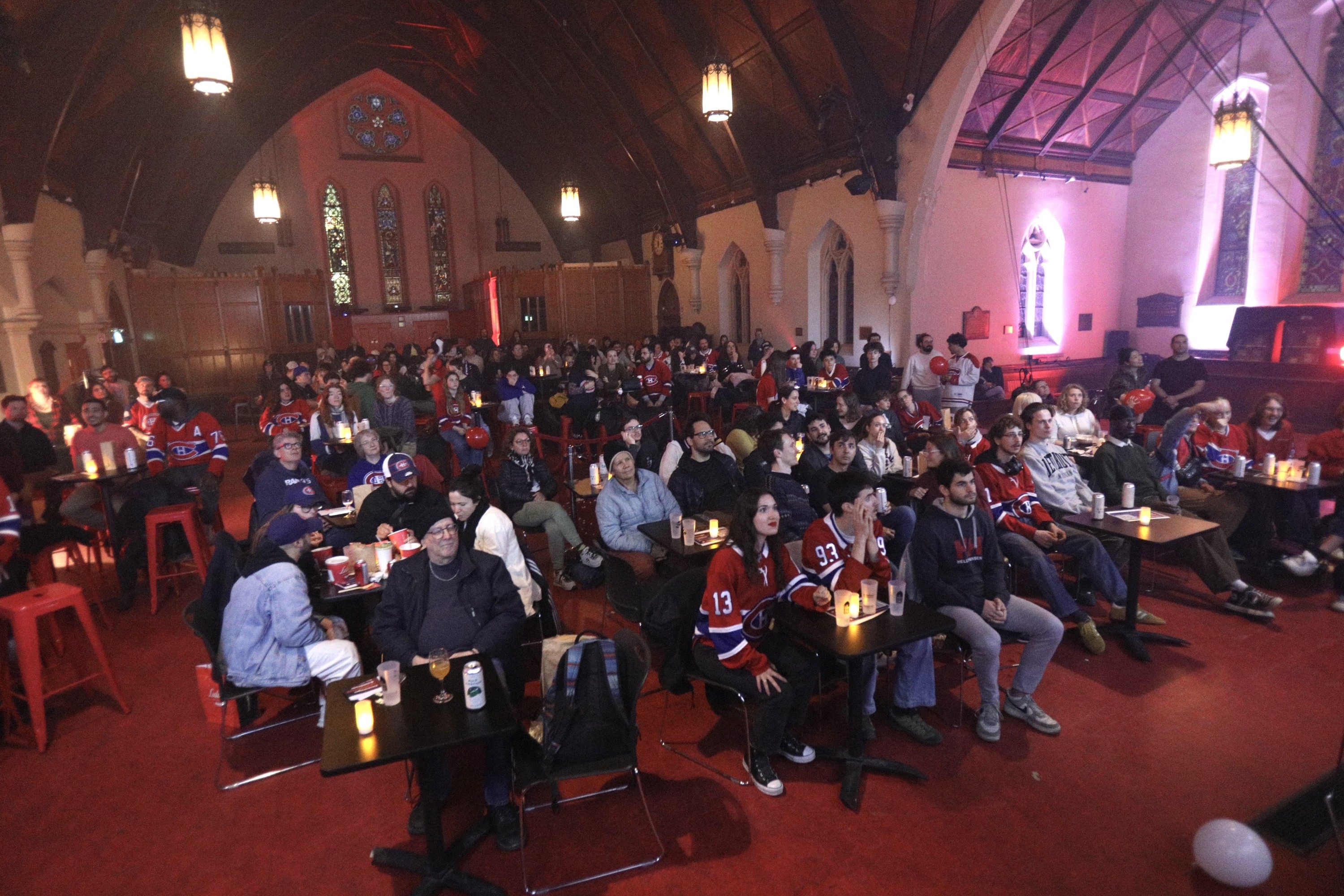 Hockey fans watching game inside church