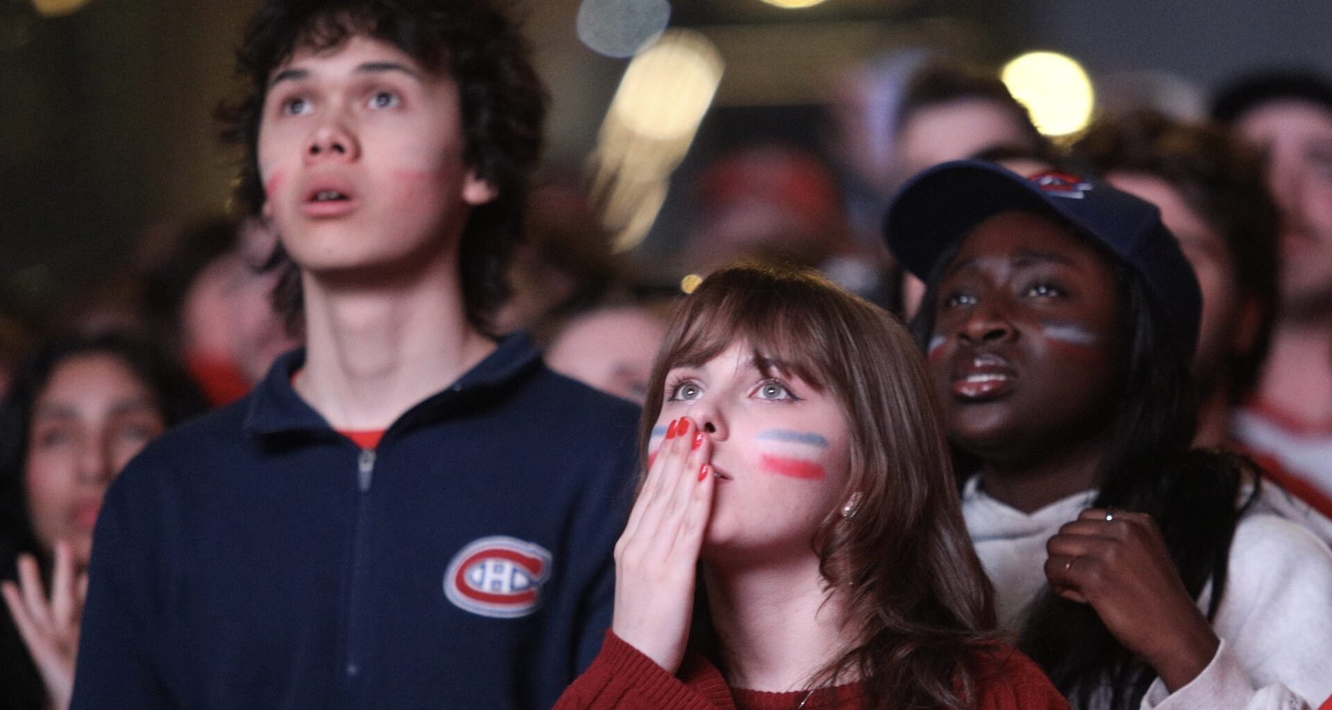 Fans watch on a screen as the Canadiens were playing the Buffalo Sabres during Game 6 in Montreal.