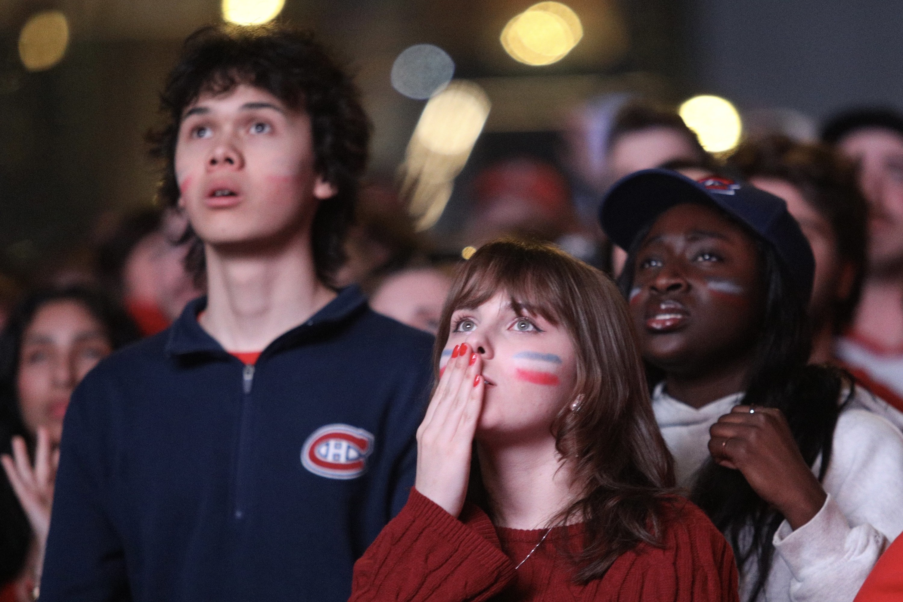 Fans watch on a screen as the Canadiens were playing the Buffalo Sabres during Game 6 in Montreal.