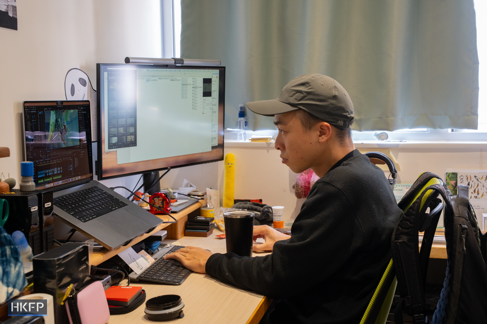 Fung Hon-shing edits videos in his studio in an industrial building in Tsuen Wan on January 16, 2026. Photo: Kyle Lam/HKFP.