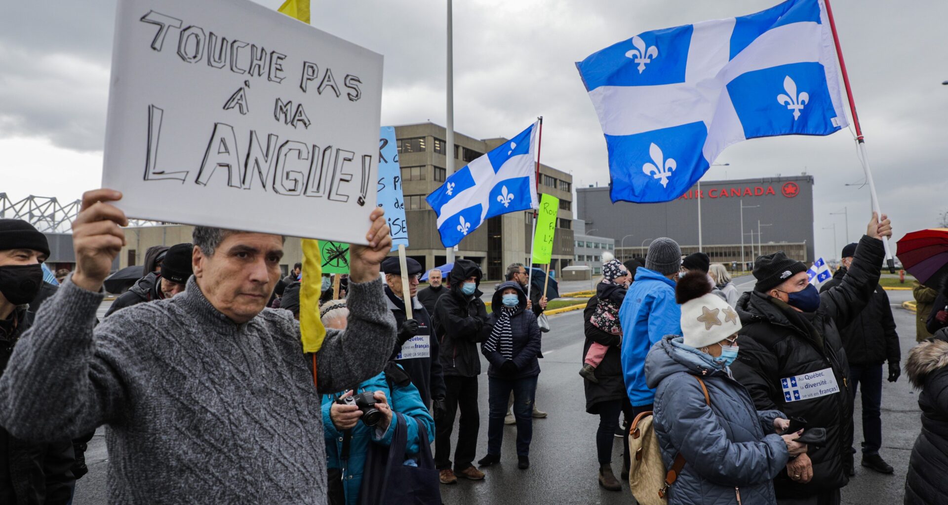 People attend a protest in front of the Air Canada head office in Montreal.