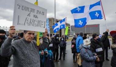 People attend a protest in front of the Air Canada head office in Montreal.