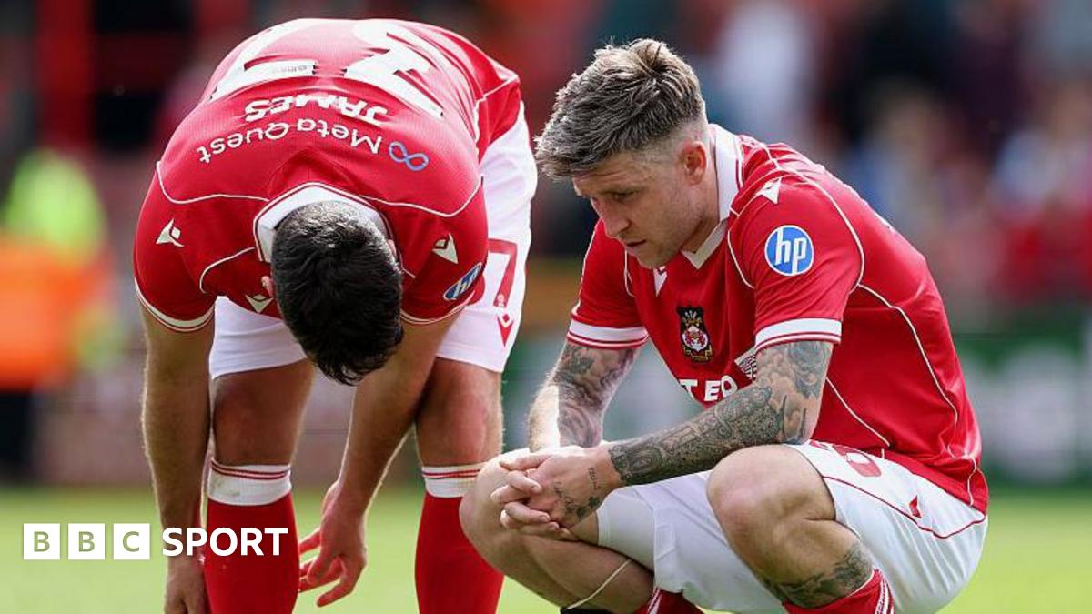 Wrexham duo Matty James (left) and Josh Windass (right) look dejected