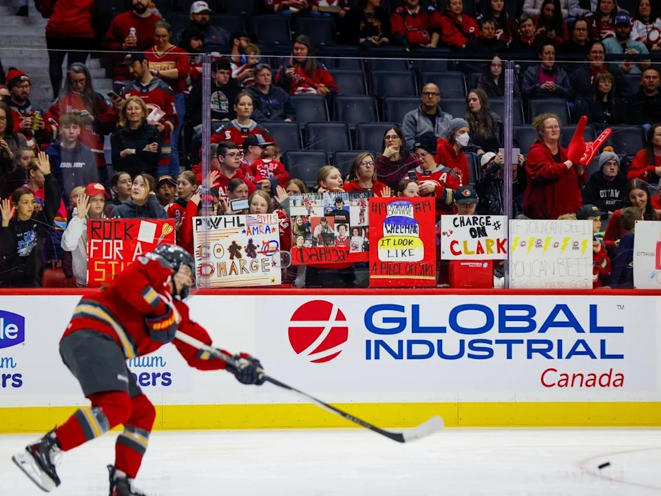 An Ottawa Charge player takes a shot during warmups as fans wave their signs behind the glass at the Canadian Tire Centre on April 3, 2026.