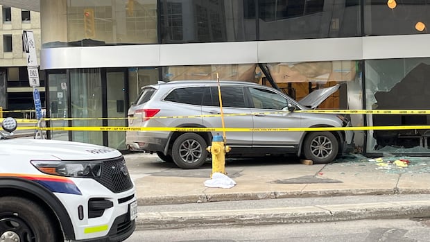 SUV strikes pedestrian, crashes into building, paramedics say