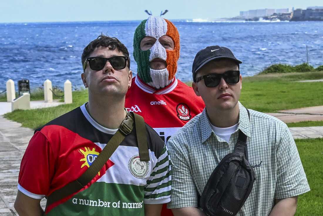 Moglai Bap (left), DJ Provai (middle) and Mo Chara (right), members of Irish band Kneecap, pose for a photo at the National Hotel in Havana, on March 20, 2026.