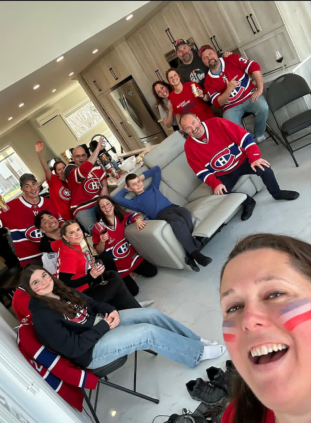 Melissa Parise and members of her family, wearing Montreal Canadiens jerseys, prepare to watch game 7 of the playoff series at the Bell Centre in downtown Montreal as the Canadiens take on the Tampa Bay Lightning in Tampa.