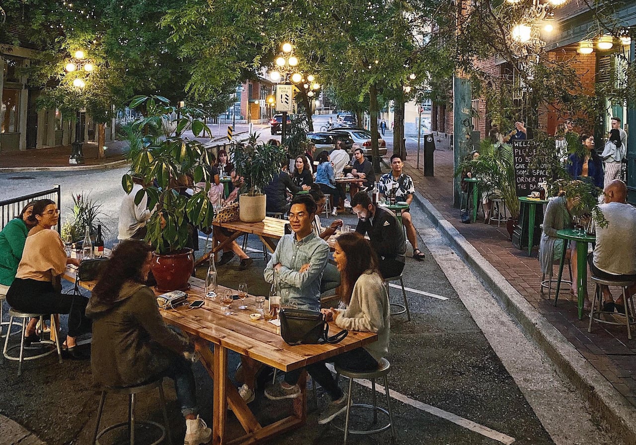 People sitting outside at a restaurant.