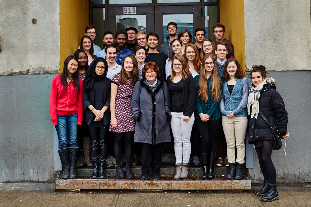 A group of students surround prominent jurist Louise Arbour.
