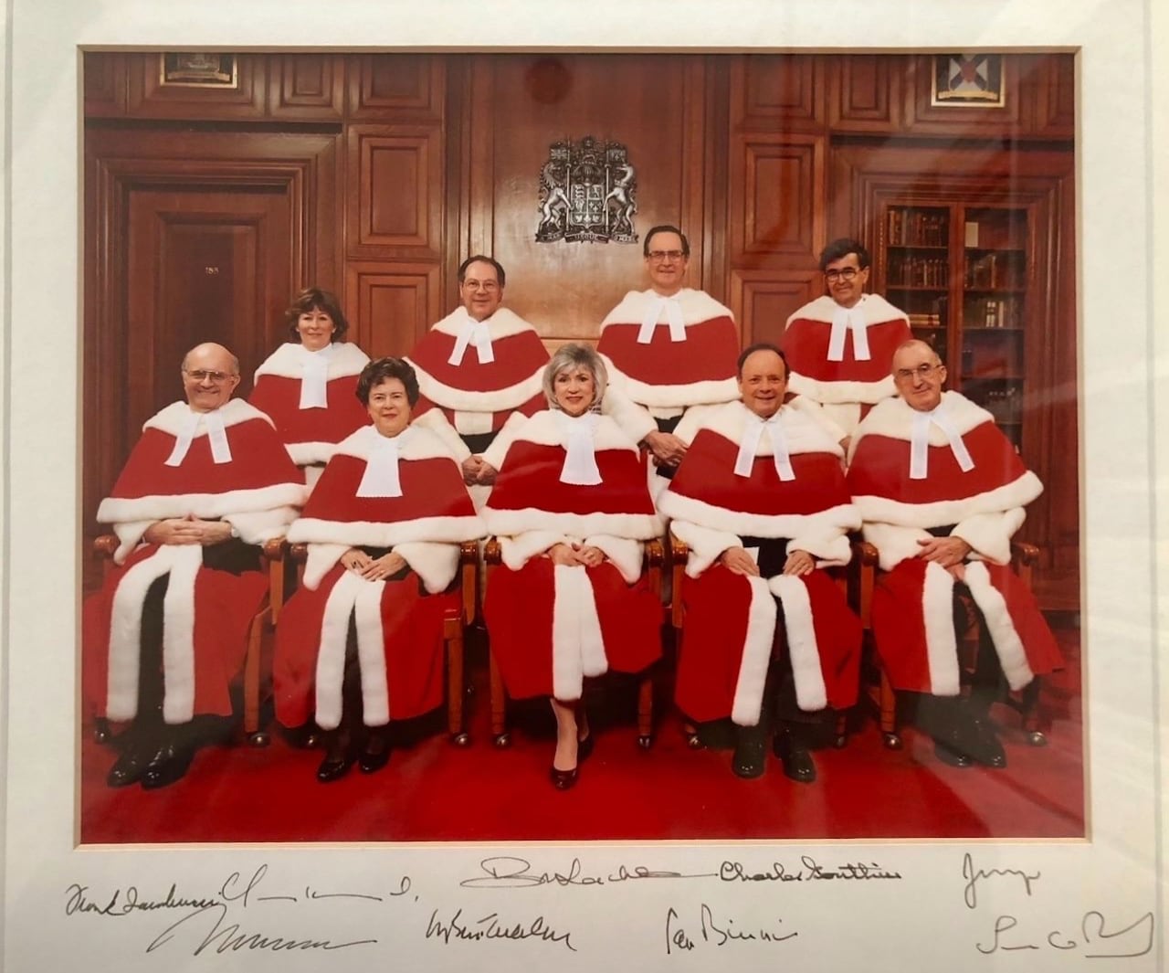 A photo of Canada's Supreme Court justices in 2001 is pictured along with their signatures.