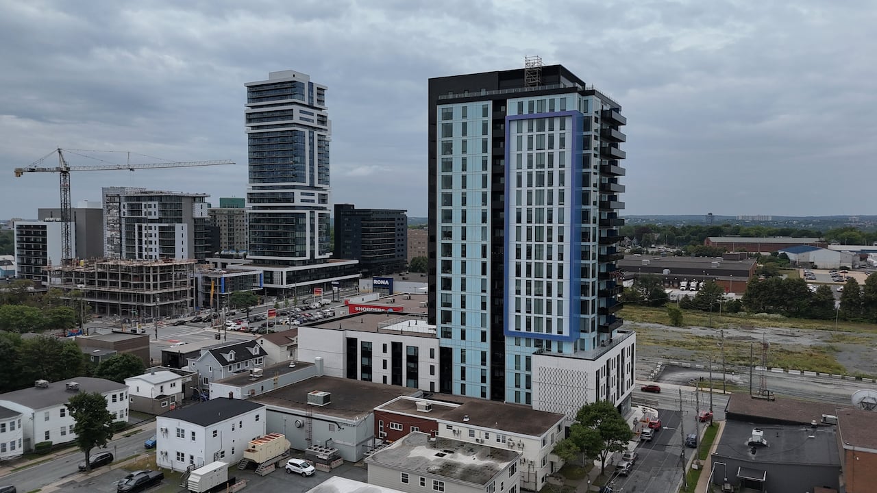 An aerial view of apartment buildings and streetscapes.