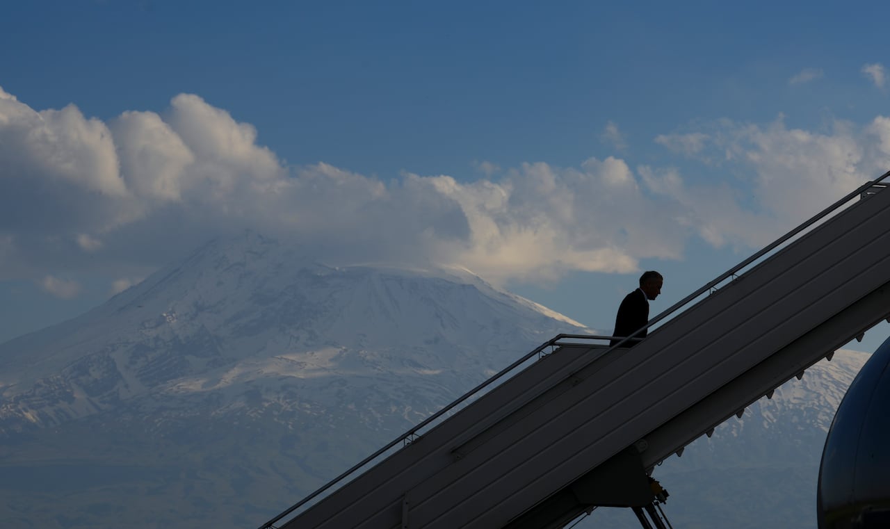 A man boards a plane.