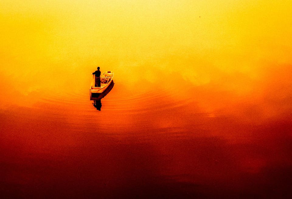 Photo Awards: Fishermen returning from their catch, bathed in the sunset. I