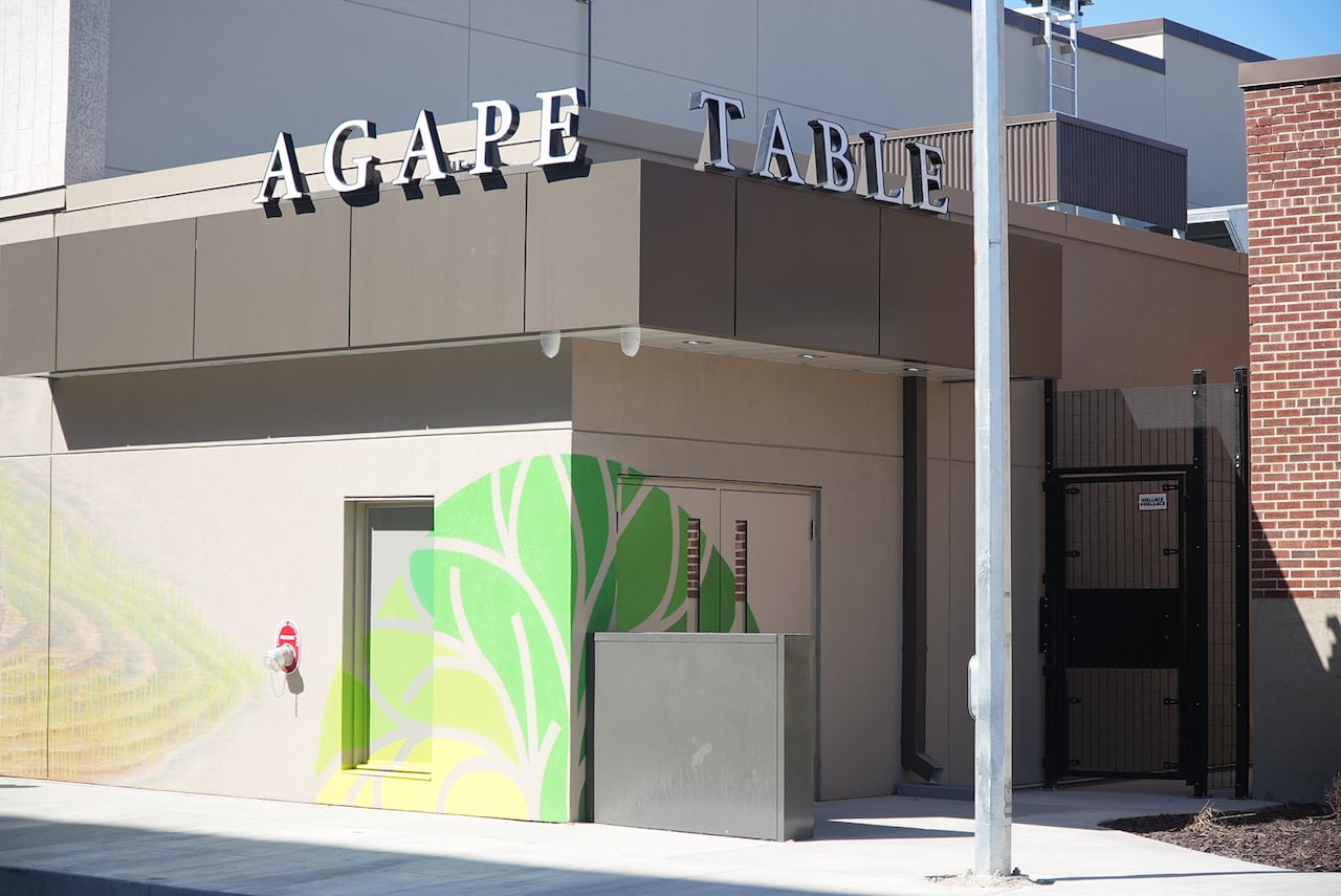 The outside of a building that says Agape Table.