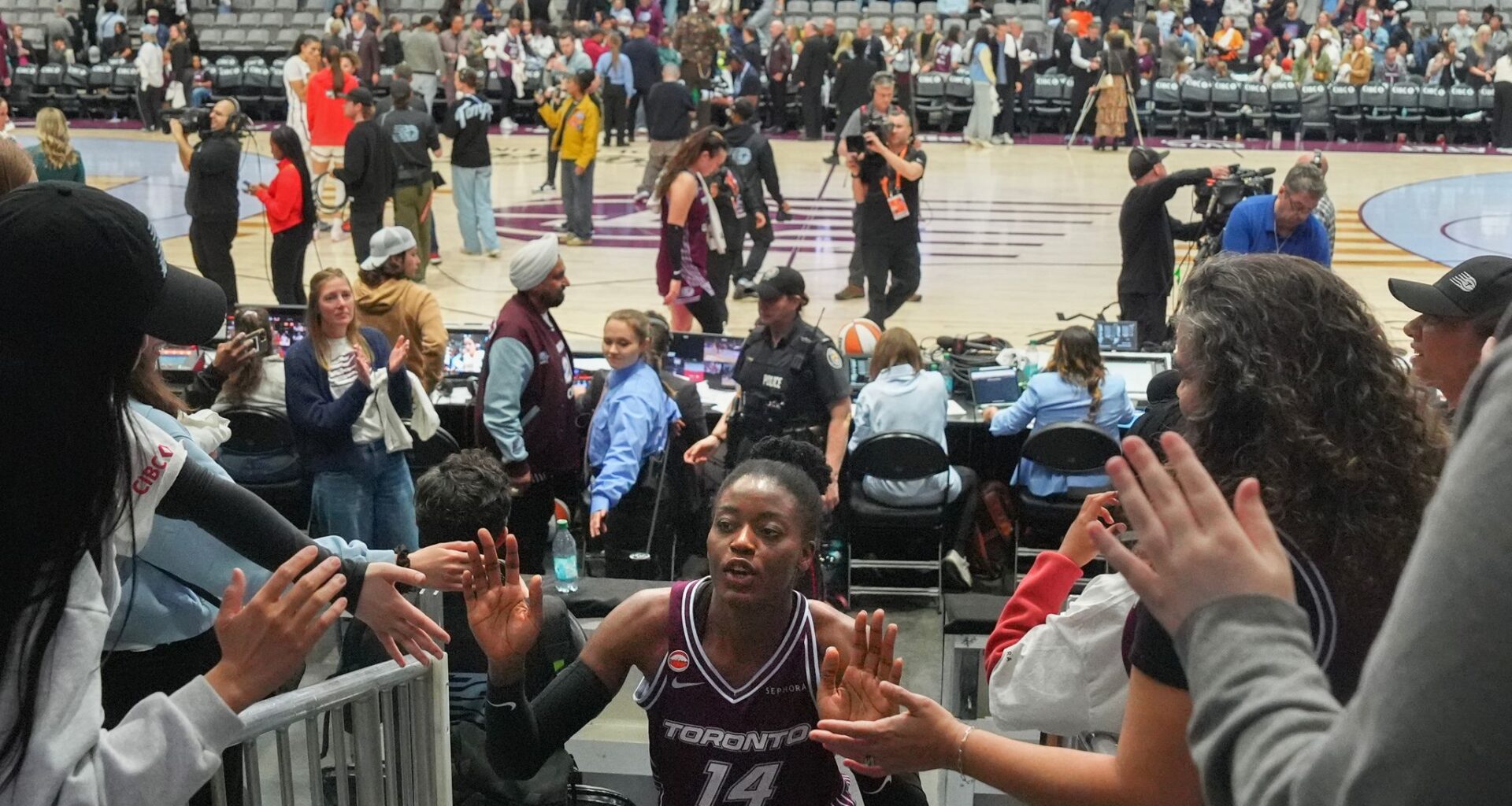 Toronto's first WNBA game is no thing of beauty, but sellout crowd finds plenty to cheer