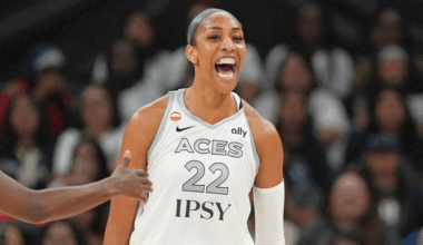 A’ja Wilson (22) reacts after scoring while drawing a foul during the first half against the Dallas Wings.