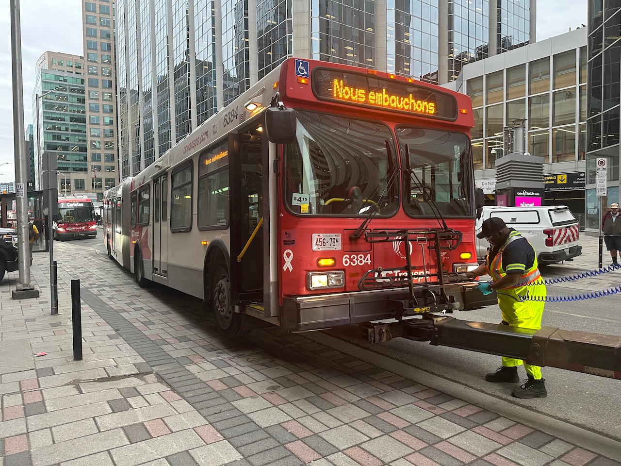 A bus getting towed.